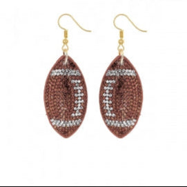 Football-shaped earrings with rhinestone details on a white background