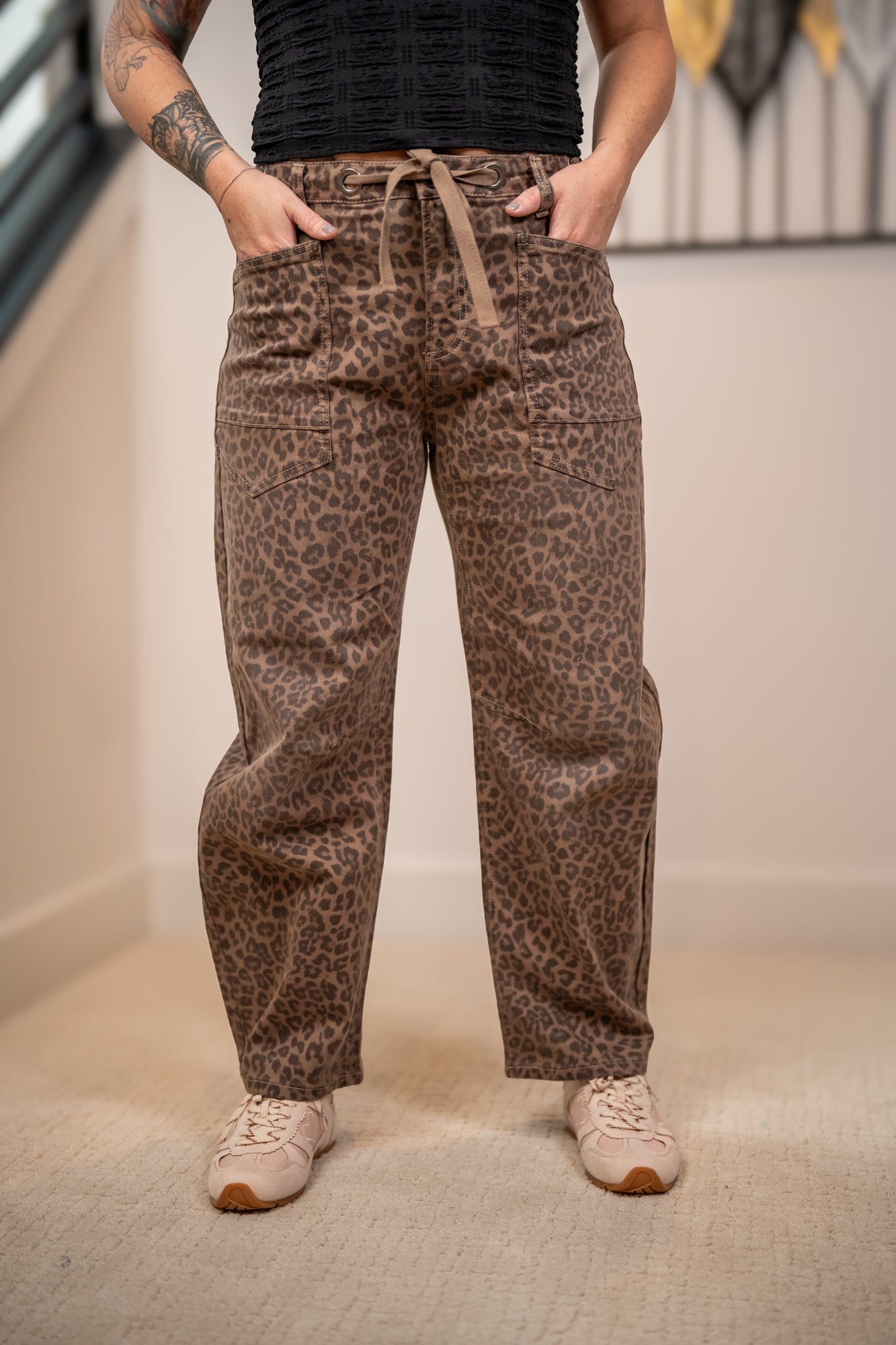 Close up of leopard print fabric and cargo pocket on Risen barrel fit pants