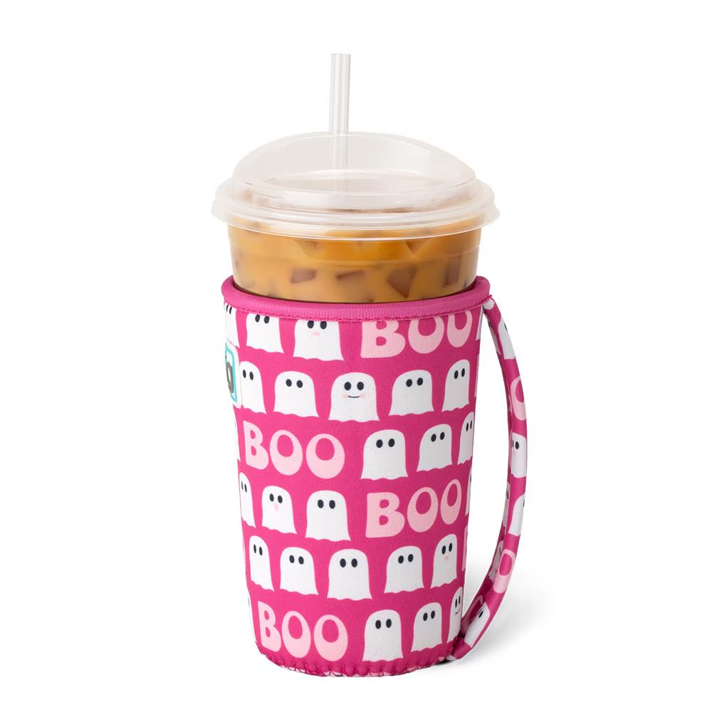 A pink neoprene cup coolie with 'BOO' text and ghost patterns, designed to keep iced drinks cold, shown with a cup inserted.
