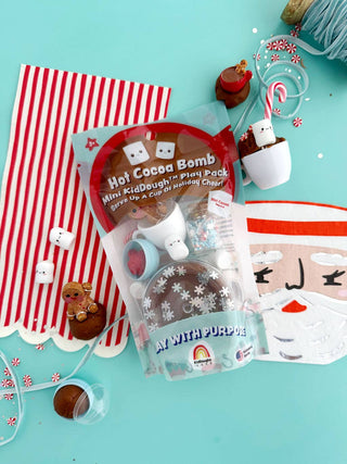 Hot Cocoa Bomb Mini KidDough Play Pack with brown dough, mug, marshmallows, and holiday accessories