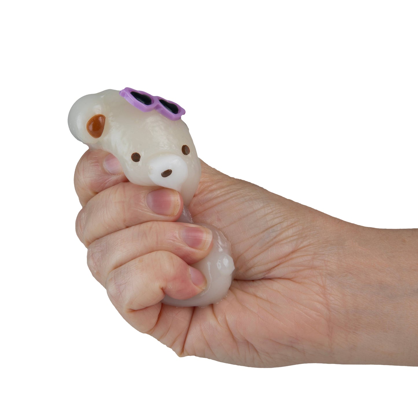 Hand holding white translucent squishy toy animal with purple sunglasses