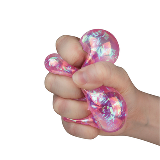 Hand squeezing pink iridescent holographic stress ball toy with shimmery crystal-like interior