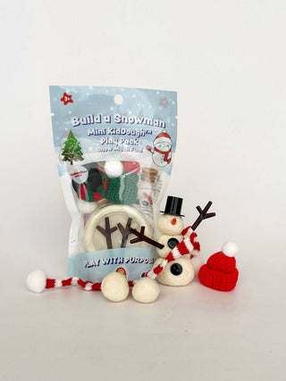 Build a Snowman Mini KidDough Play Pack with assembled snowman, knit accessories, and dough balls