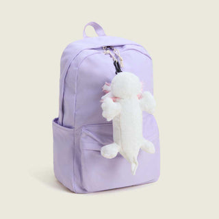 Warmies Axolotl Bag Charm clipped to a lavender backpack zipper pull
