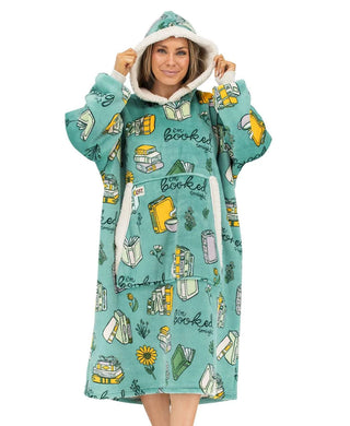 Woman wearing teal Lazyone Booked Blanket Hoodie with book print pattern and sherpa lining