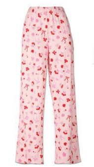Pink pajama pants with red floral pattern on a white background