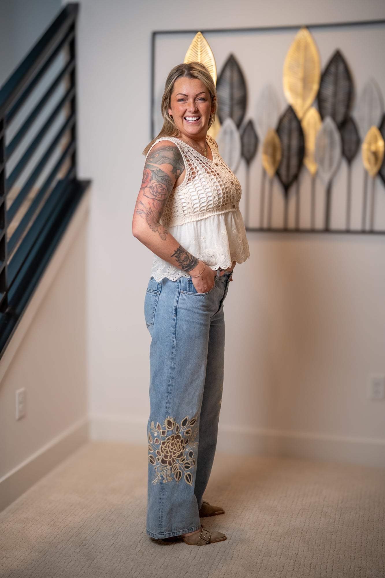 side view of light denim with floral cutout straight leg