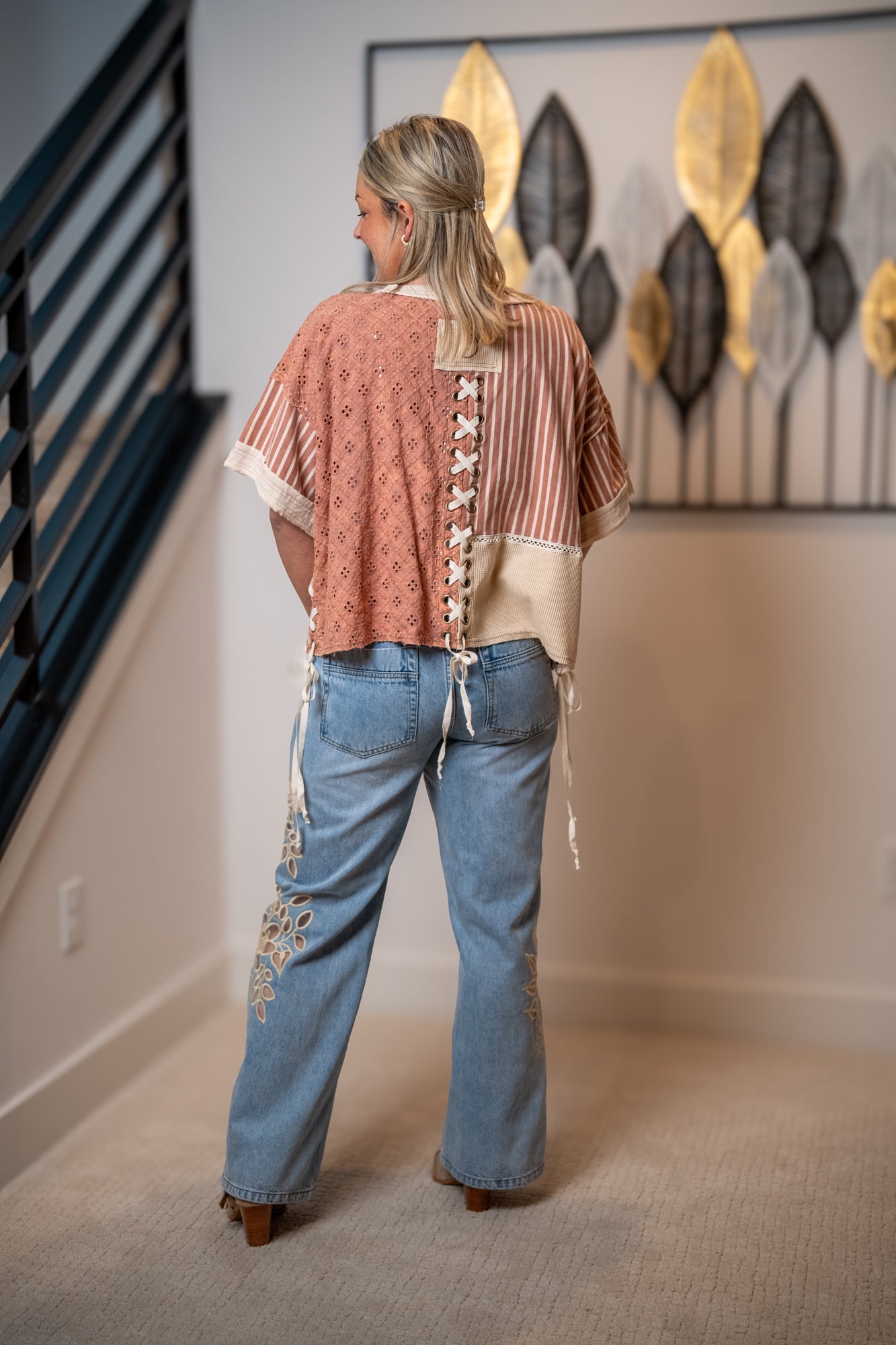 Back view of Oli and Hali crochet and stripe mix top with lace up back detail and relaxed fit