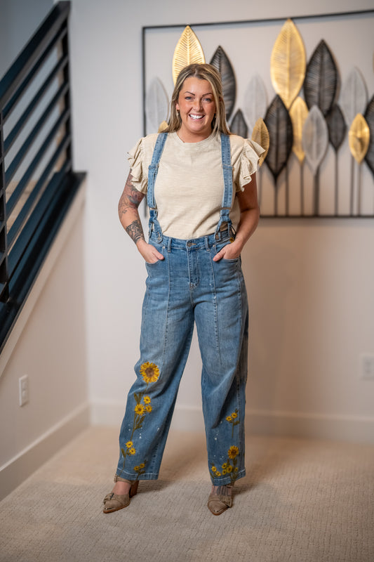 Oli and Hali sunflower embroidered denim overalls with wide leg fit and adjustable straps