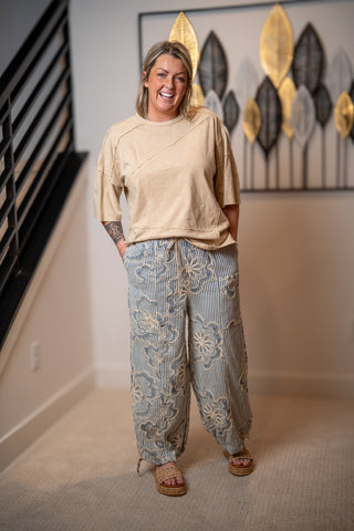 Easel blue striped woven pants with floral embroidery and loose wide leg silhouette