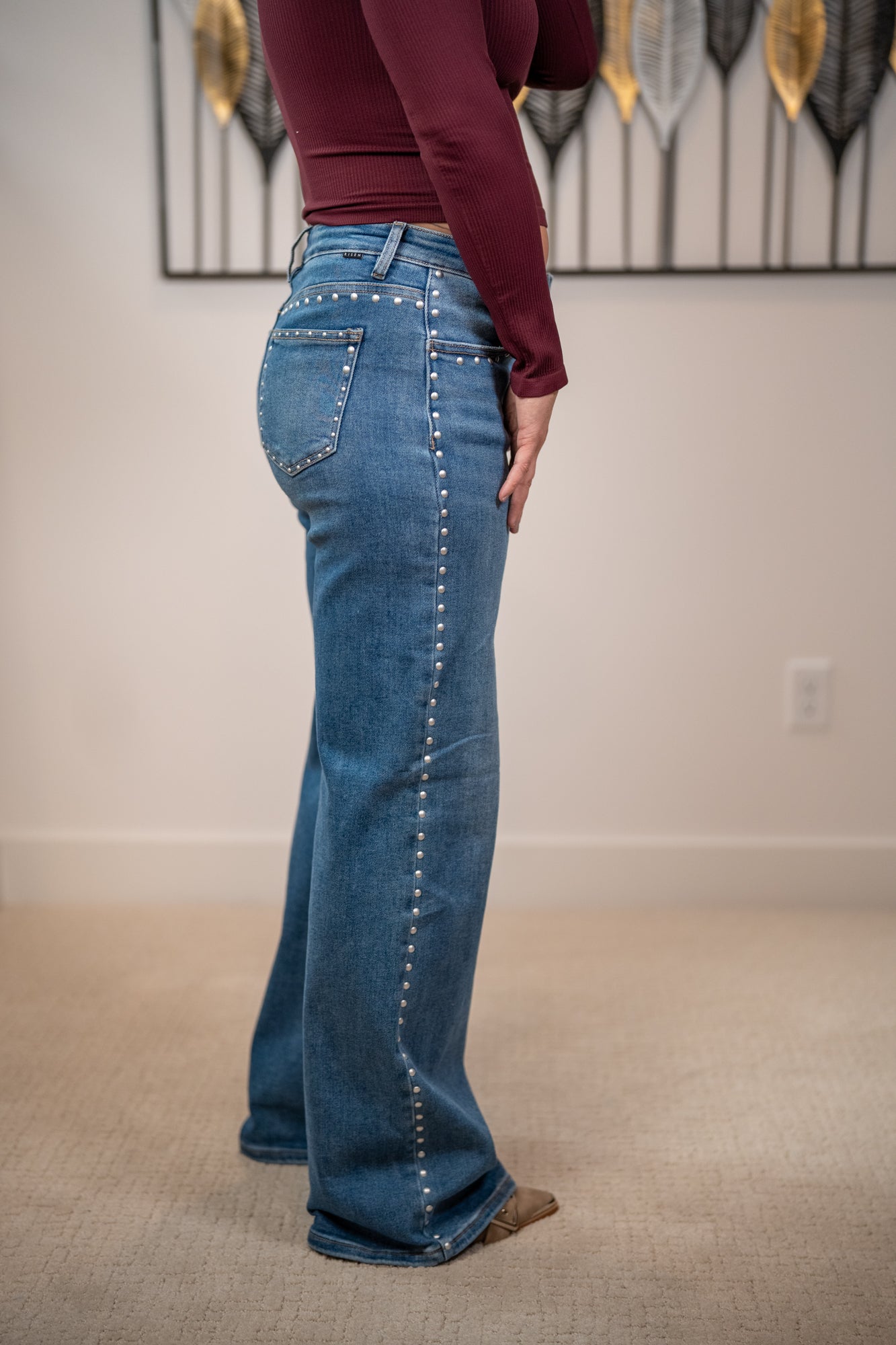 Side view Studded wide leg jeans by Risen in medium wash with high waist and relaxed straight leg fit