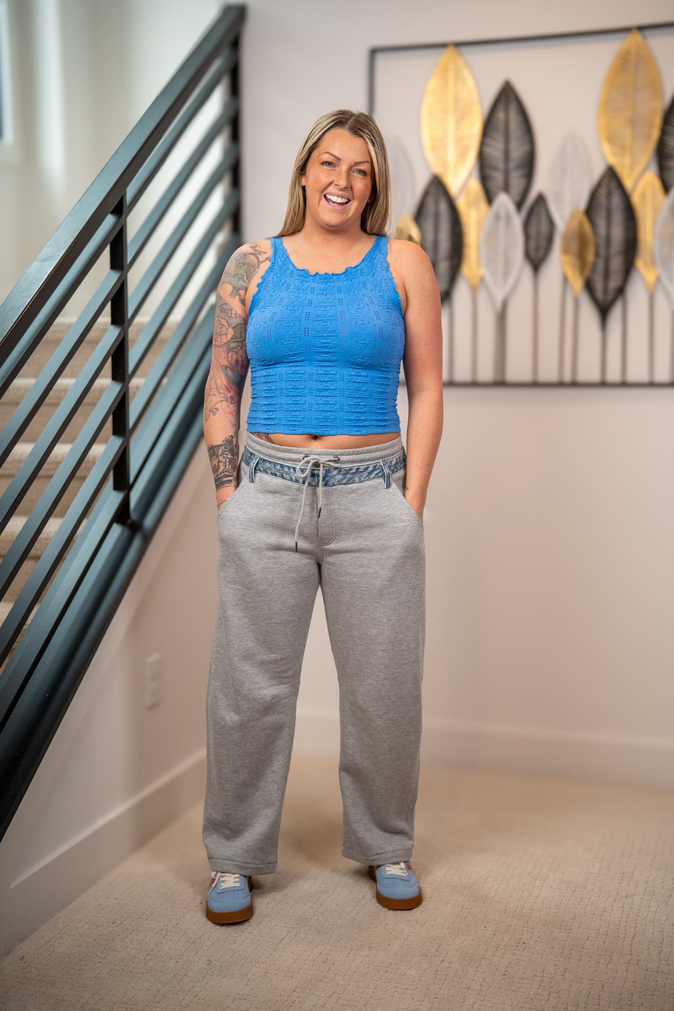 Risen slouchy barrel leg contrast denim detail pants with drawstring waist front view styled with blue textured crop tank