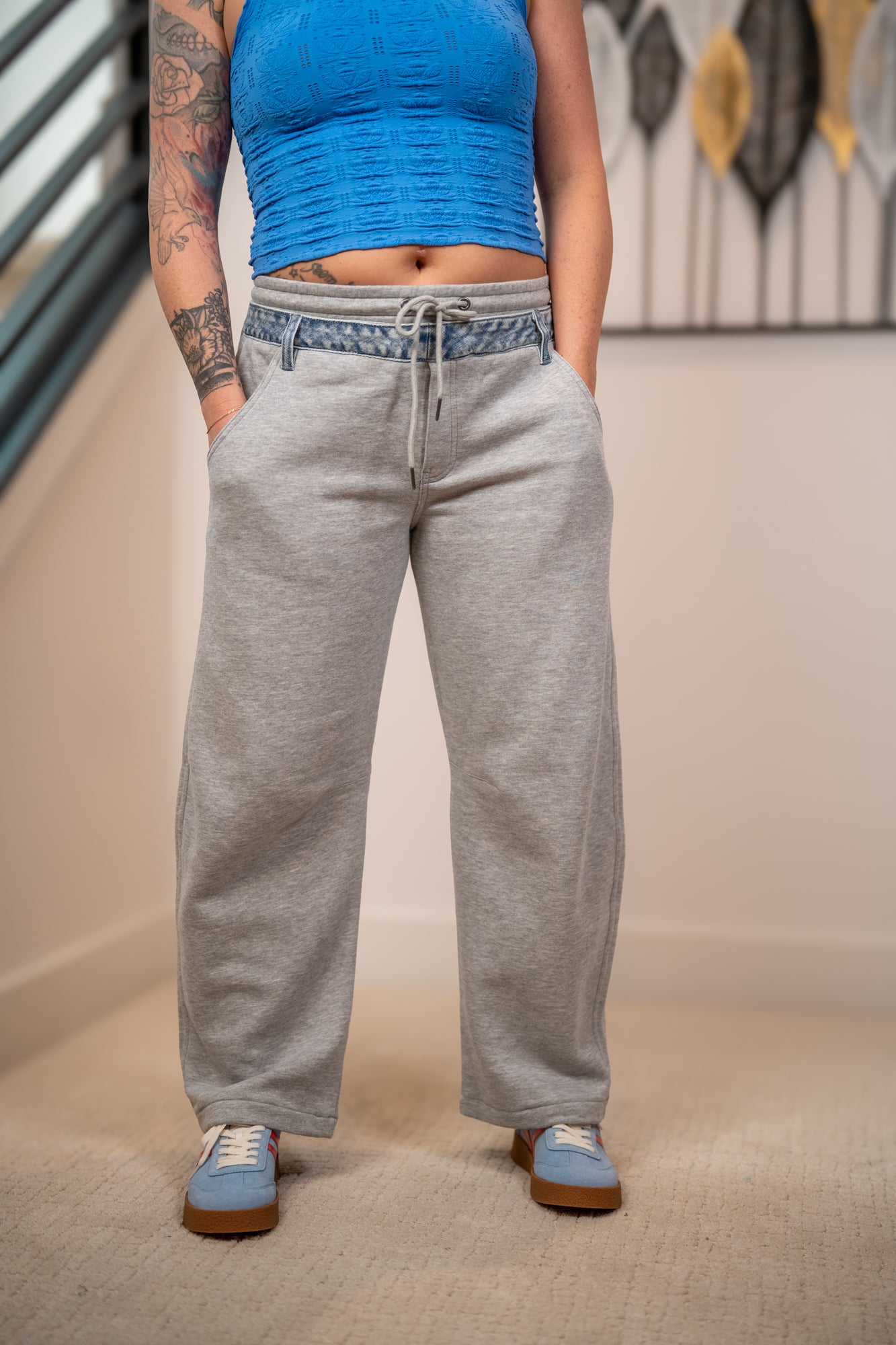 Close up of Risen slouchy barrel leg contrast denim waistband detail with drawstring and front pockets