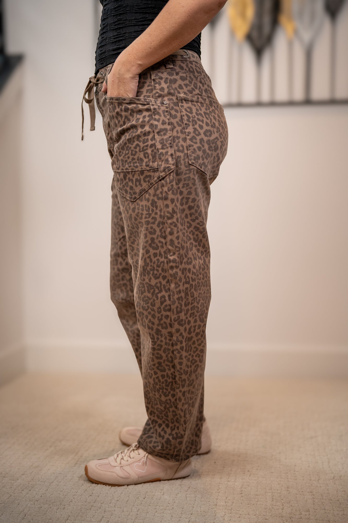 Side view of Risen leopard barrel fit pants with relaxed leg