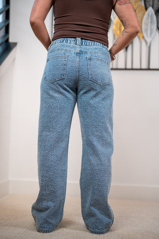 Back view of the rhinestone covered denim showing the pockets and the elastic waistband