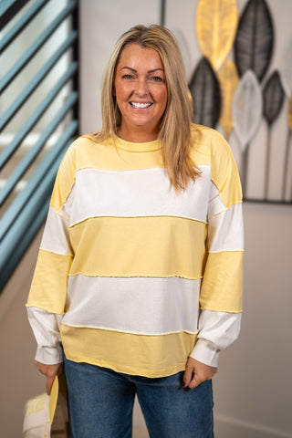 Yellow and white striped oversized long sleeve pullover top with crew neck