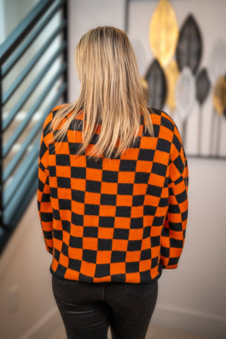 Orange and black checkerboard knit Halloween cardigan sweater, back view