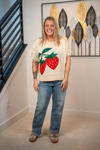 Cream short-sleeve knit sweater with large red strawberry intarsia pattern by Easel
