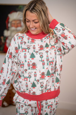Rareraw nutcracker print Christmas pajama set in red and green on white