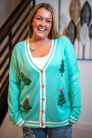 Mint green Christmas tree cardigan with pink buttons and white stripe trim