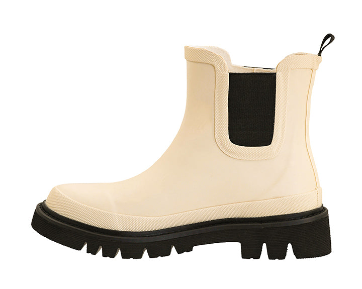 Side view of Corkys Drizzle ivory waterproof style rain boots with black platform lug sole