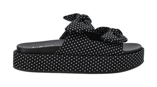 orkys Lil Bit Knotty black polka dot platform sandals with cushioned footbed and bow straps