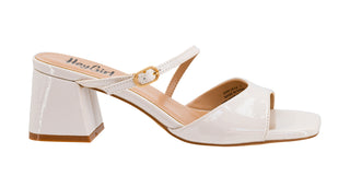 Side view of Corkys Ooh La La white patent block heel sandal with square toe and buckle instep strap