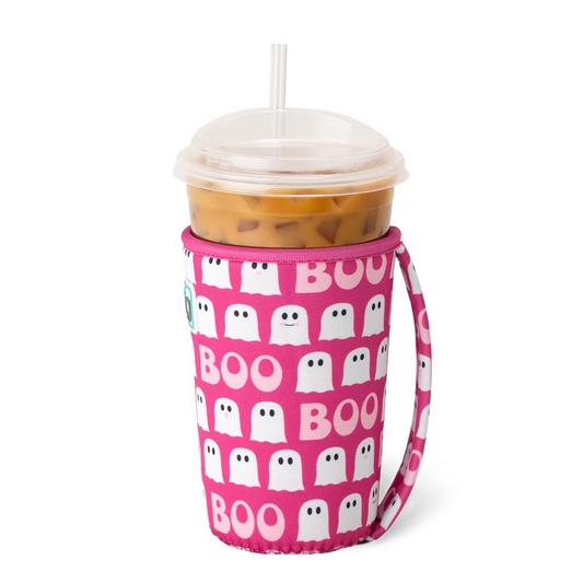 A pink neoprene cup coolie with 'BOO' text and ghost patterns, designed to keep iced drinks cold, shown with a cup inserted.