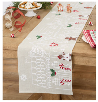 Gingerbread Town embellished table runner with gingerbread houses and holiday motifs on natural linen