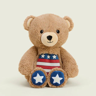 Brown plush teddy bear with American flag belly and blue star-print feet