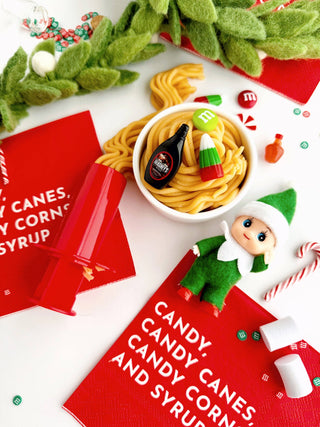 Elf play kit with noodle dough bowl, mini candy accessories, and holiday napkins